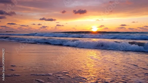 Wallpaper Mural Vibrant sunset paints the sky and ocean waves with warm colors on a tranquil Torontodigital.ca