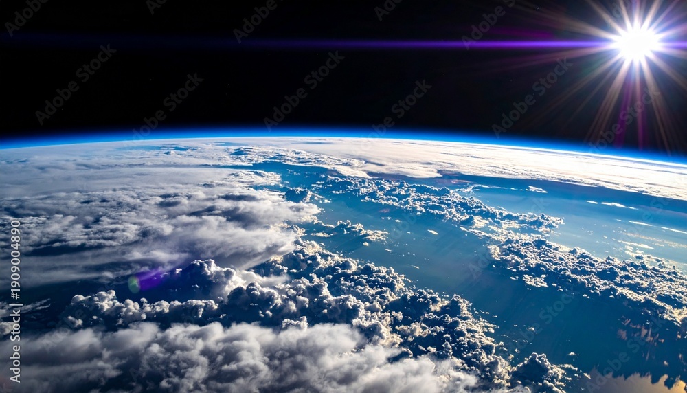 Fototapeta premium Earth's Atmosphere from Space with Brilliant Sunburst and Cloud Layers at High Altitude