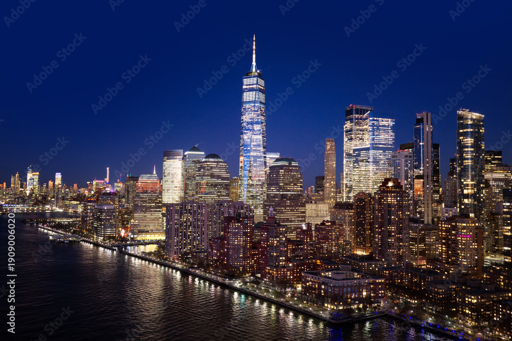 Fototapeta premium New York City landscape with skyscrapers. New York night skyline view. NYC metropolis aerial view at night. New York City panoramic night view of Manhattan.
