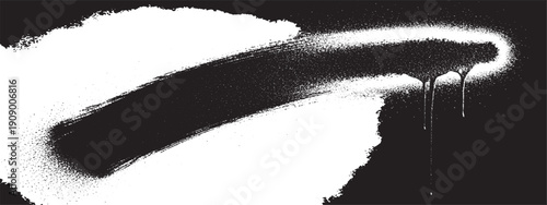 Spray paint stroke with drips on black background.