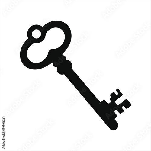 Antique black skeleton key features an ornate bow and a bit against white