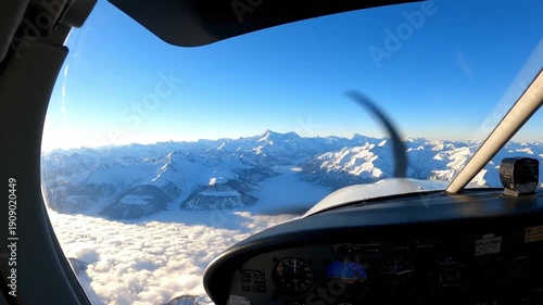 Flying over Winter Alps Peaks and Cloud Inversion Landscape