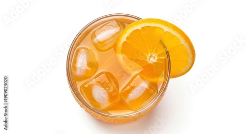 Overhead view of a glass with ice an orange slice and an orange beverage