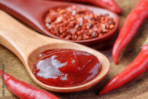 Wallpaper Mural Wooden spoons of dried chili pepper flakes and pepper paste Torontodigital.ca