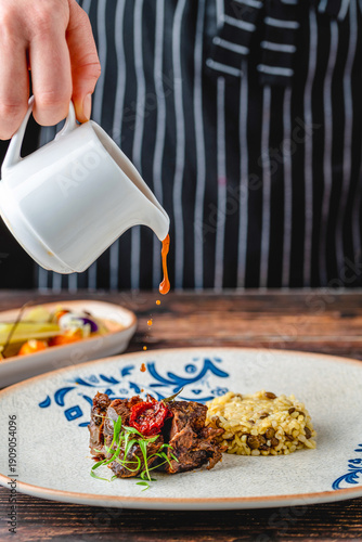 Wallpaper Mural Braised beef served with bulgur pilaf on rustic ceramic plate Torontodigital.ca