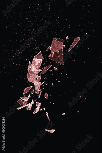 Shattered red glass close-up on black background. Texture of broken glass.	