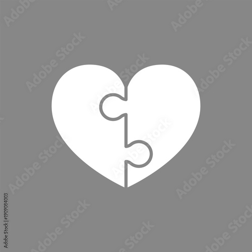 Puzzle heart icon. White heart shape formed by two interlocking white puzzle pieces. Vector illustration.