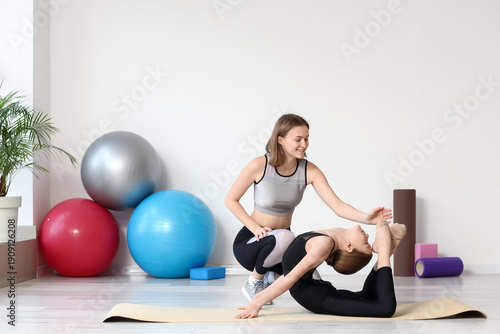 Cute girl doing gymnastics ...
