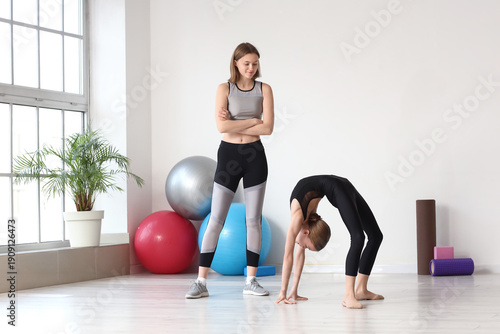 Cute girl doing gymnastics ...