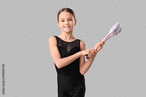 Cute girl with gymnastics c...