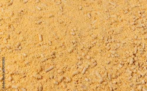 Obraz na płótnie pellets from pine sawdust after getting on them with a large amount of water, the wood pallets got wet and crumbled into sawdust, some of them did not get wet and retained their cylindrical shape