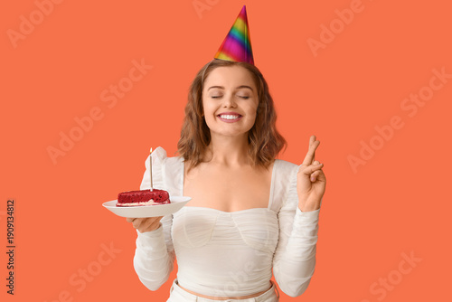 Young woman in party hat wi...