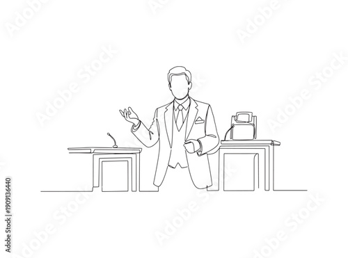 Businessman standing at a desk in a suit gesturing