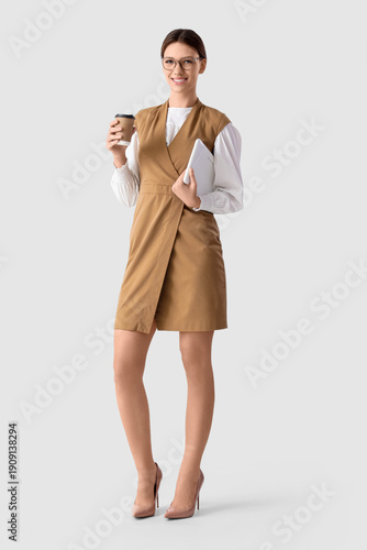 Young businesswoman with la...