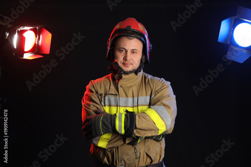 Male firefighter on dark ba...