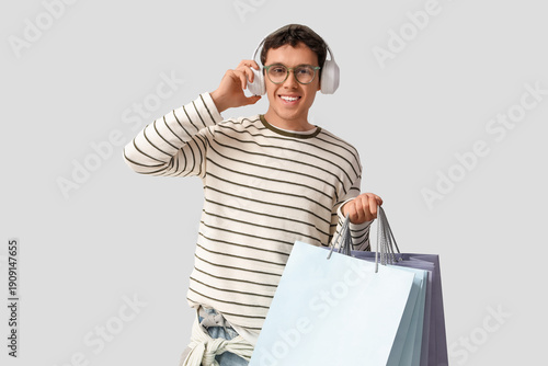 Stylish young man in headph...