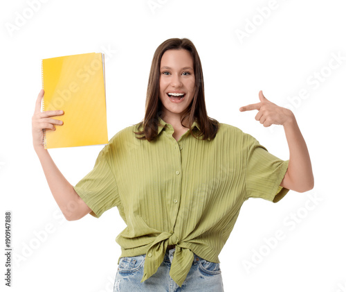 Young woman pointing at notebook on white background
