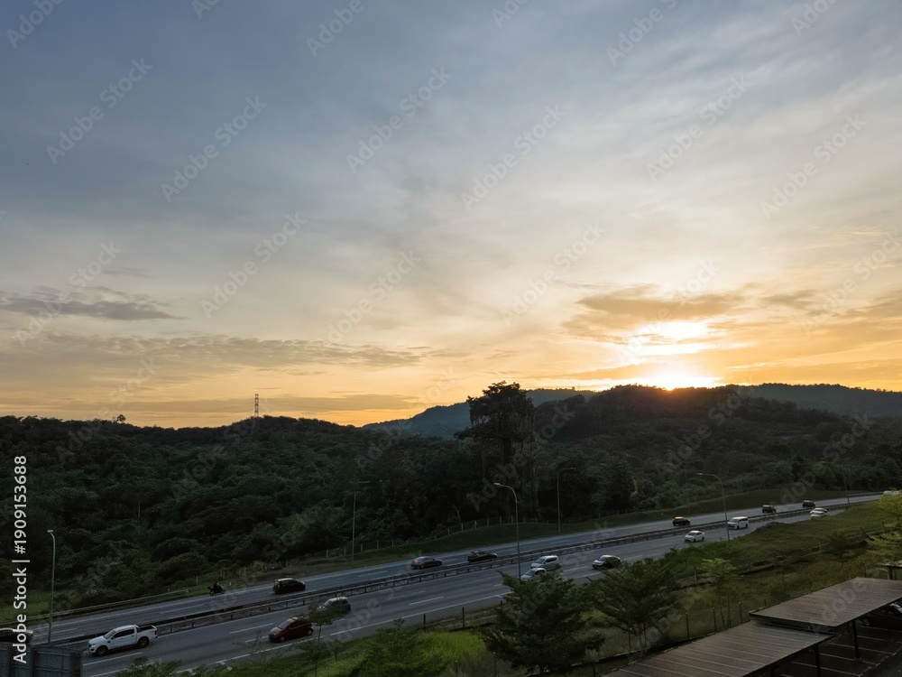 Fototapeta premium Sunrise near the highway in Malaysia, viewed from an apartment.
