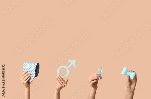 Female hands with blue ribb...