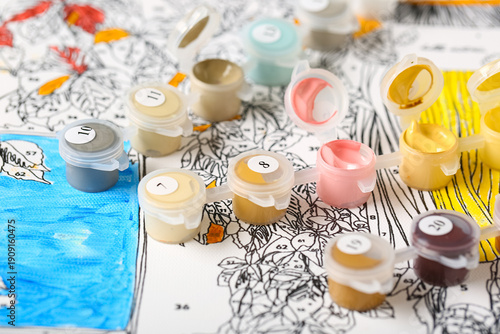 Set of cans with paints on ...