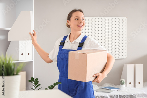 Female worker with box and ...