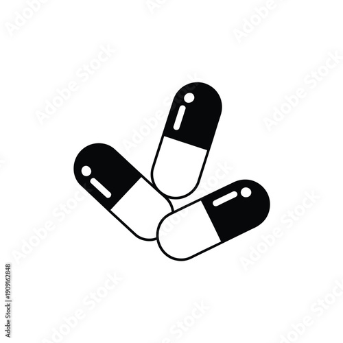 Three black and white capsules scattered on a white background