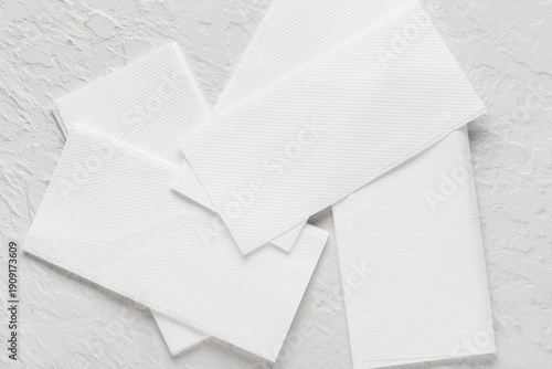 Paper napkins on white text...