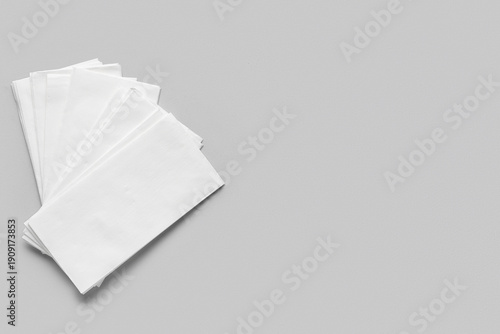 Paper napkins on grey backg...