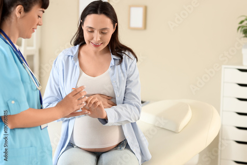 Young pregnant woman with d...
