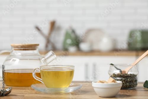 Glass cup and teapot of hot...