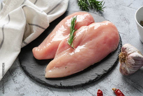 Black board with raw chicke...