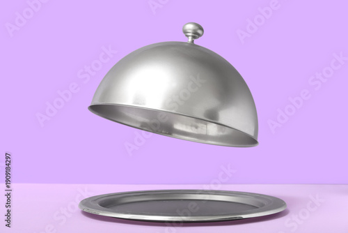 Silver tray with open cloch...