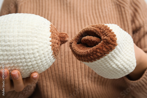 Woman with knitted model of...
