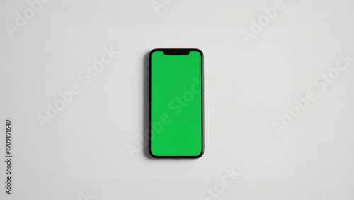 Smartphone with green chroma key screen on white background, ideal for mockups and product presentations