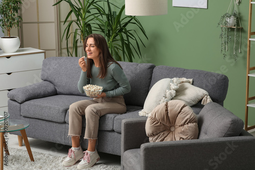 Beautiful woman with popcor...