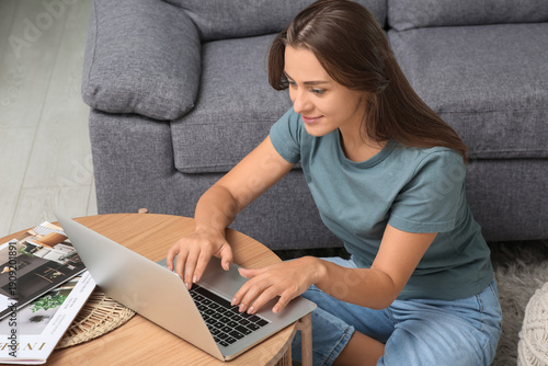 Beautiful woman using lapto...