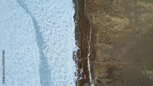 Photography Aerial Waves Meeting Barren Shoreline, Soft Foam Lines Against Wet Sand, Muted P