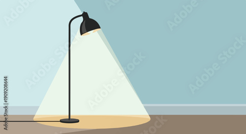 A black floor lamp casts a warm glow on a floor and wall