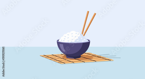 A bowl of white rice with chopsticks on a mat