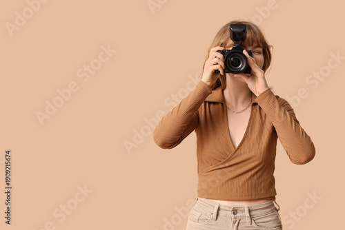 Young woman with modern cam...