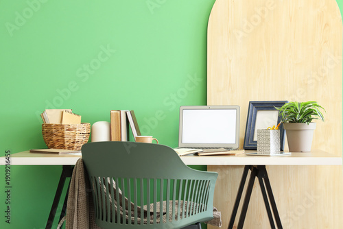 Stylish workplace with chai...