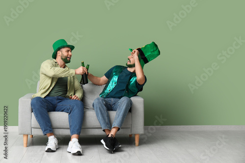 Young men in leprechaun hat...