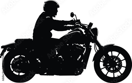 Black silhouette of a person riding a motorcycle rider