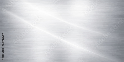 Polished silver brushed metal texture background featuring a shiny stainless steel plate pattern with light grey metallic reflections on a smooth aluminum surface material