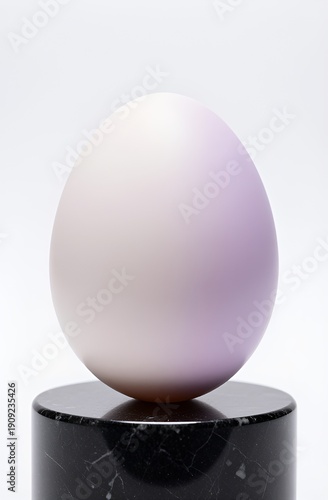 Lavender ostrich egg on black marble pedestal