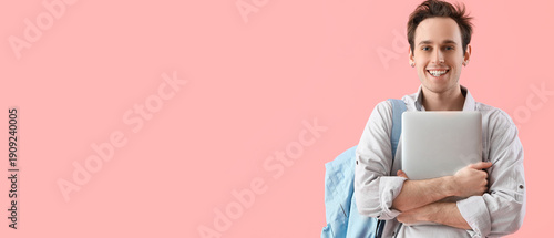 Male student with laptop on...