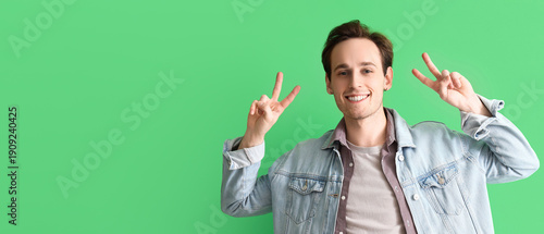 Young man showing victory g...