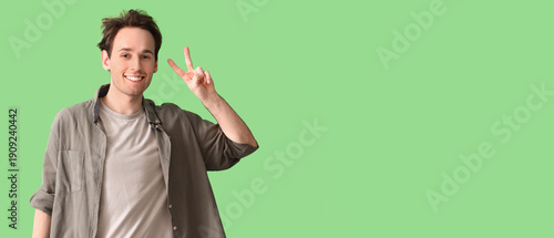 Young man showing two finge...