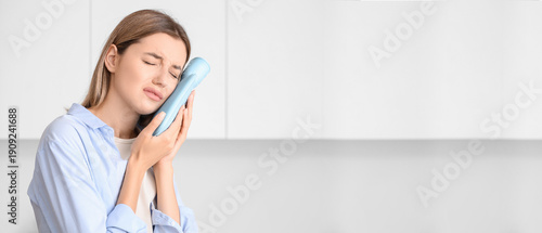 Young woman with hot-water ...