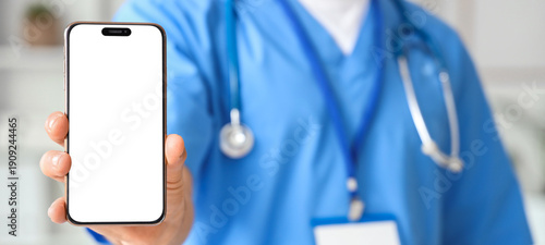 Male doctor with blank mobi...